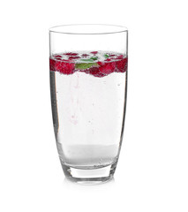 Tasty refreshing lemonade with berries in glass on white background