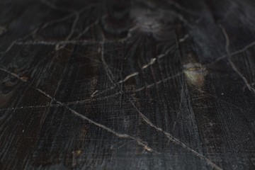 Texture black burnt wood with faux fading and cracking