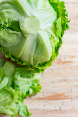 Iceberg lettuce, green vegetable from local market, farm fresh produce on wooden table