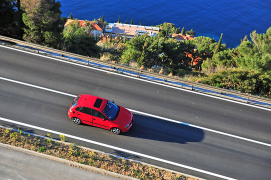 Top View Of The Red Car On The Road