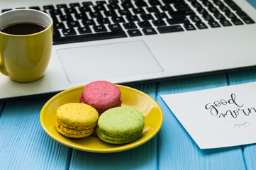 Still life with notebook on the wooden background and cup of coffee