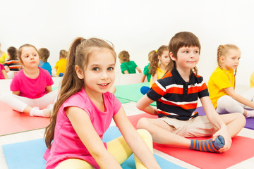 Girl sitting in butterfly pose during yoga class