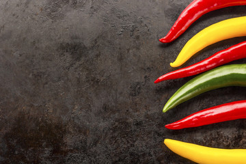 cayenne chilli peppers on rusty metal