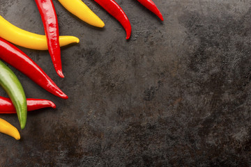 cayenne chilli peppers on rusty metal