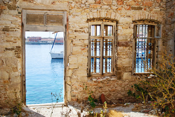 Sea view with traditional flowers near the greek house.
