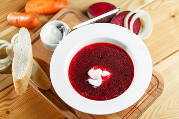 ukrainian and russian red-beet soup borscht with garlic and sour cream