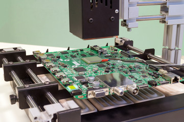 Replacing the microprocessor in bga rework station. Infrared soldering station in operation