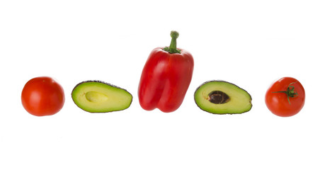 Tomatos, avocados, and sweet pepper on white background