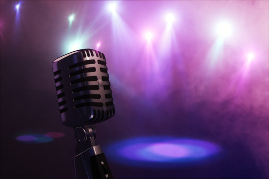 Old retro microphone with stage lighting background