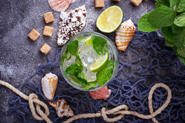 Summer drink mojito with rum, mint, ice and lime