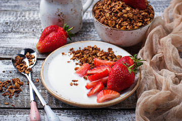 Granola with yogurt and strawberries