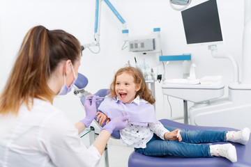 Little girl in dentist chair