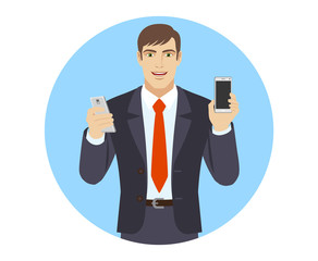 Businessman with two mobile phones