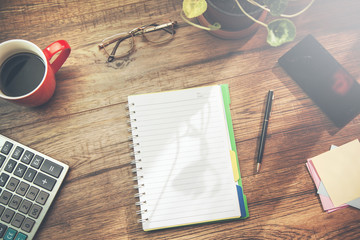 notepad and stationary on table