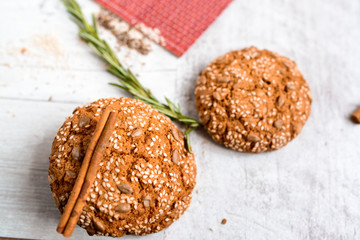 Warm Homemade ginger biscuit cookie topped with sugar and sesame seeds