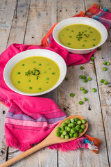 Fresh green pea soup with pea seeds.
