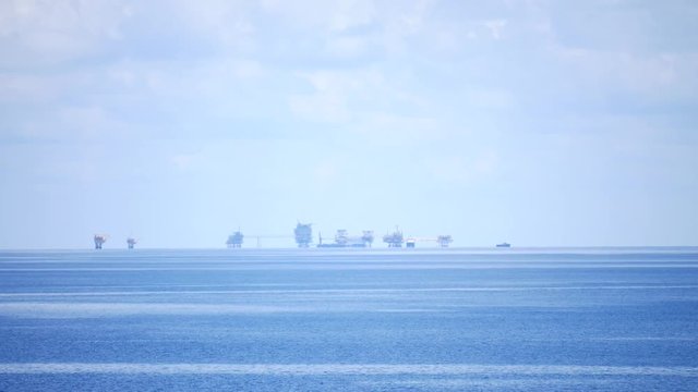 Central processing platform (cpp) in the middle of the ocean on sunny day - upstream industry
