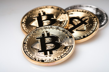 Golden bitcoin isolated on white background