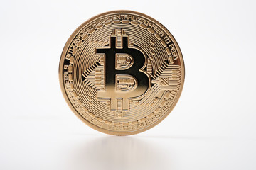 Golden bitcoin isolated on white background