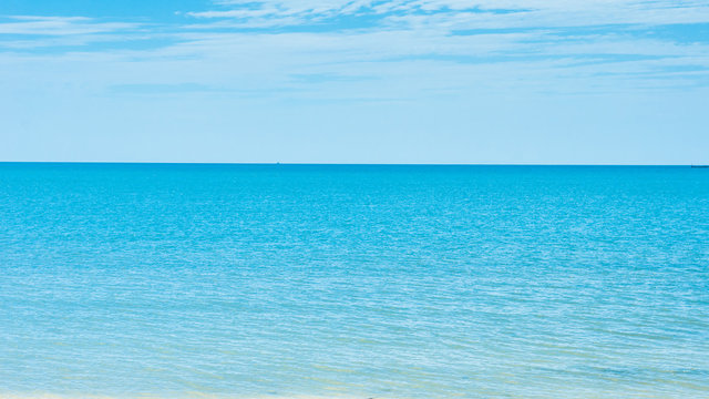 Fototapeta Blue and bright open sea with clear sky in summer