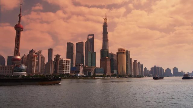 panoramic of Shanghai sunset,Lujiazui Financial Center,busy Huangpu River shipping.