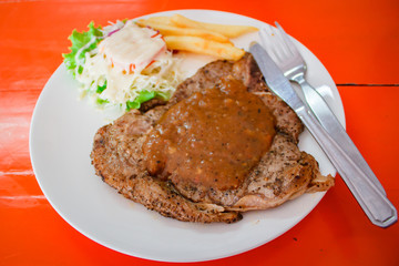Beef steak and salad.