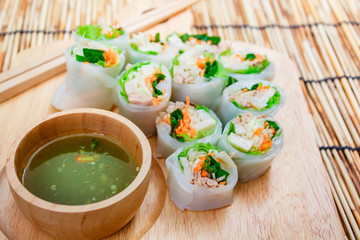 Fresh vegetable noodle spring roll with spicy sauce.