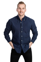 Fototapeta premium Handsome blonde man standing against a white background wearing a blue shirt and jeans. 