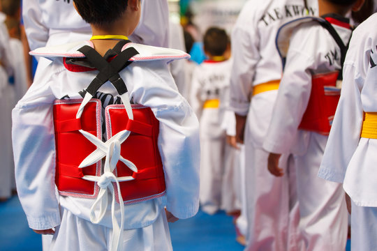 Taekwondo athlete in white uniform with armour