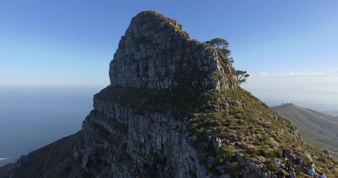 Cinematic smooth drone shot of the Lion's Head mountain with the city of Cape Town in the background