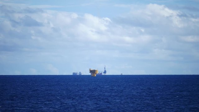 Small offshore platforms and a tender assisted drilling rig  in the middle of the ocean
