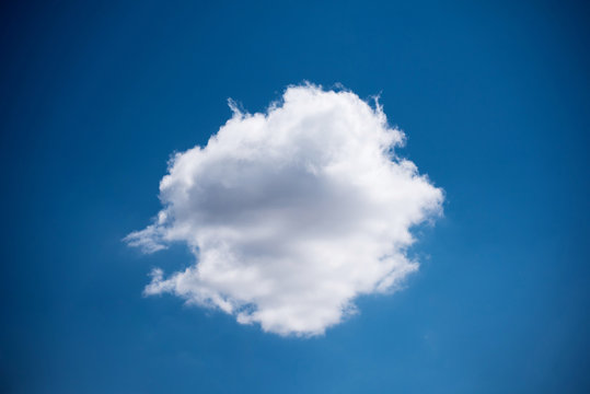 Single white cloud circle shape on blue skyshape,
