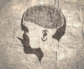 Abstract illustration of a human head with brain. Woman face silhouette. Medical theme creative concept. Concrete grunge texture