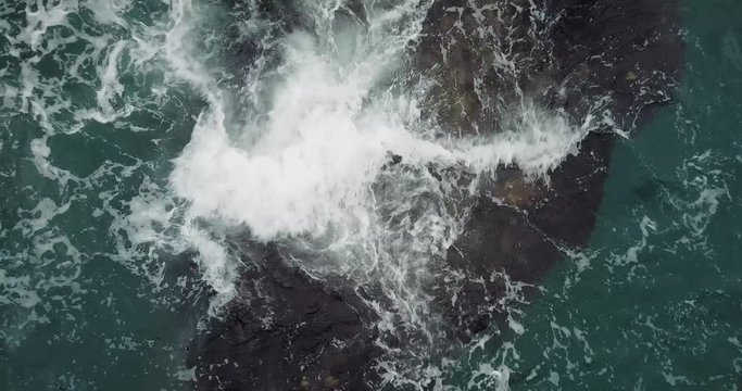 Spinning aerial of the Sea Waves Washing up on the Rocks.