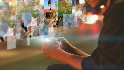 Businessman using smartphone and virtual screen, Social media concept.
