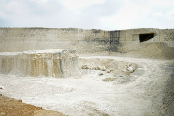 The exploitation of limestone hills forming a unique architectural in Jeddih or Jaddih Hill Madura Island, Indonesia