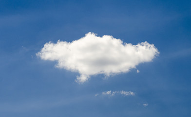 Single cloud in deep blue summer sky
