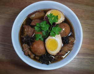 Eggs and pork in brown sauce frogs.