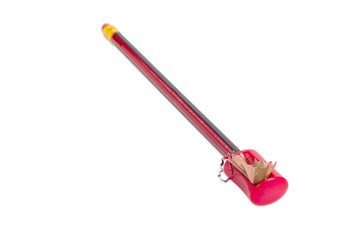 Manual prism sharpener and the pencil during sharpening