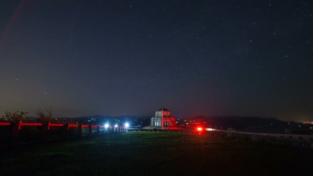 Time lapse movie of moving night sky and auto traffic from Vista house viewpoint along Columbia River Gorge in Portland Oregon 4k uhd