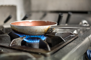 Heating frying pan on burners