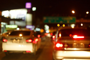 Fototapeta na wymiar night light of traffic car on the city street, abstract blur bokeh background
