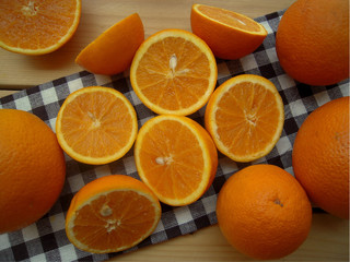Oranges cut into halves, prepared for make juice.