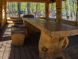 Arbor in a park of logs. Relax in the summer.