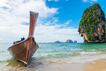 Beautiful view of the Thai boat and rocks in the sea