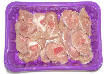 Fresh turkey chops thigh on a foam meat tray