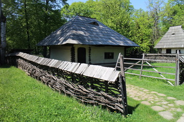 House with wickerworked fence in Dimitrie Gusti National Village Museum in Bucharest, Romania