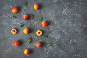 Apricot on black background. Sliced apricot. Top view, flat lay, copy space