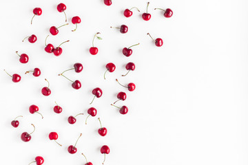 Cherry pattern. Fresh sweet cherry on white background. Flat lay, top view, copy space