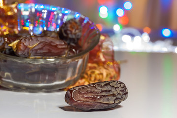 Ramadan, Eid concept background of Date fruit with illuminated out of focus lights